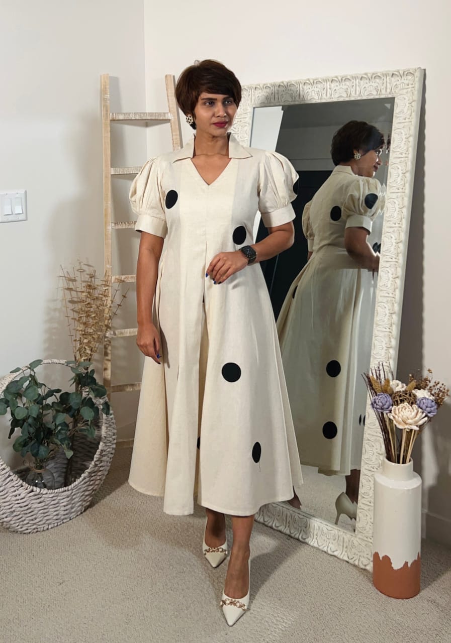 A Beautiful Cream colour Black polka Design Gown