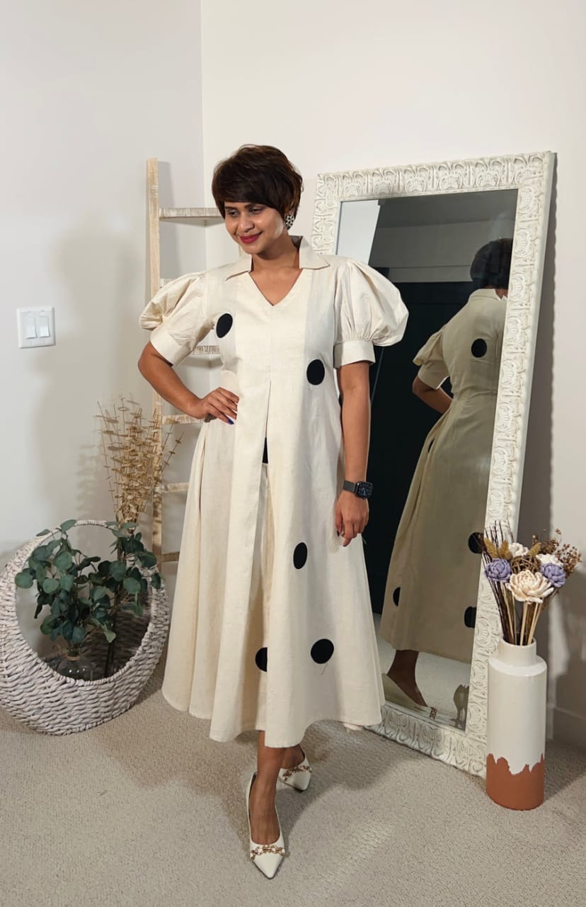 A Beautiful Cream colour Black polka Design Gown